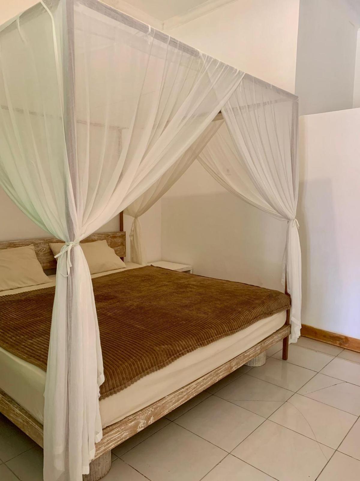 The Village Rua Beach Homestay Buitenkant foto